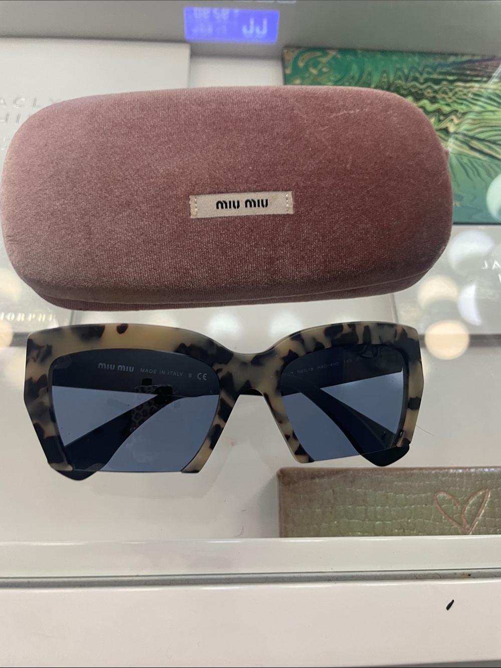 Miu Miu Tortoiseshell Cat-Eye Sunglasses with Dark Blue Lenses